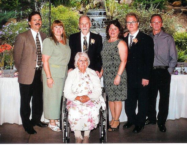 jimsandy5eldest.jpg - Jim and Sandy with 5 eldest chldren. L to R  Jeff;  Sandy;  Jim;  Robin;  Doug;  Brad. Seated is my wife Sandy. Picture taken at my Grand-daughter Rachel and Matthew's wedding reception, August 18, 2007